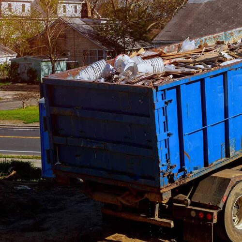 blue-truck-filled-with-junk-and-trash-laurens-sc