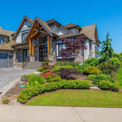 large-house-with-gray-garage-doors-laurens-sc